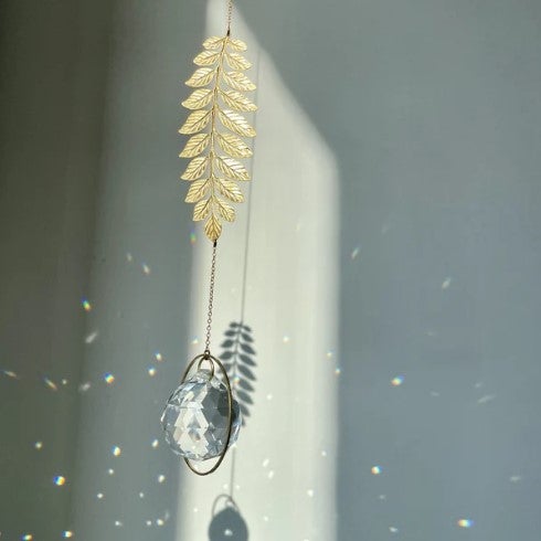 Aurinkosieppari, kristalli ja oksa